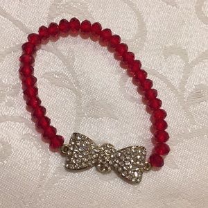 Red bracelet with Gold Bow